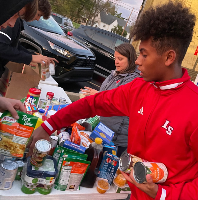 Student packs canned goods